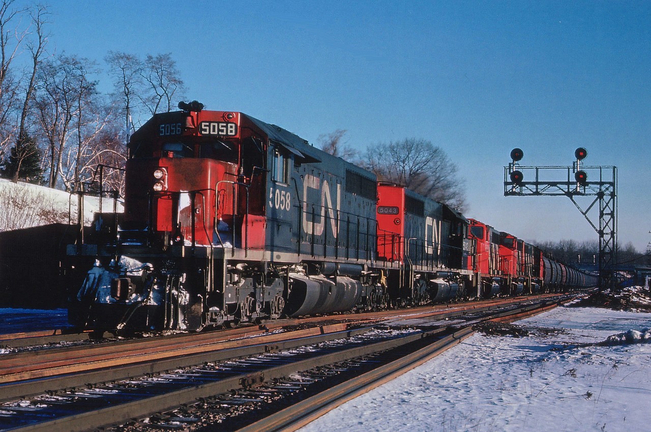 Hamilton-bound thru Bayview on a cold January morning comes the Dofasco Ore train; a regular fixture up until 1990 when the mines near Temagami shut down due to lack of profitability. On this day we see CN 5058, 5043, a pair of SD40s, and behind, three GP40-2L. No numbers recorded, had written them down on my hand, and before transferring them to something logical, like a piece of paper.......well, they got smeared.