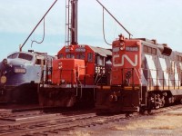 In this lineup of locomotives out front of the CN Diesel Shop in Fort Erie the old Norfolk & Western cab unit is the "star" of the show. The GP38-2 5506 not looking too shabby either. (it is still around, re#'d 4706 in 1988).  The GP9, based at Fort Erie over most all the years I wandered down there, went off for a rebuild by 1993.  The N&W? No idea of its demise.  Anyone??