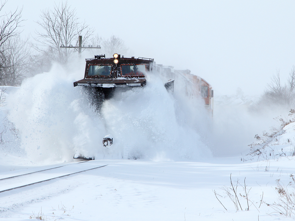 Work Plow 2303 tackles some drifts while its heads east out of Baden. Following 15 minutes behind is VIA 84, which is running a little over 4hrs behind schedule.