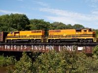 With engineer Tom at the controls, the SMSU glides over the iconic <b> THIS IS INDIAN LAND </b> bridge over the Garden River. The message on the bridge has stood for decades upon decades, and is regularly touched up by members of the local native reserve. Interestingly, at one point in history, some "vandals" changed the message to say "this was indian land"... that was fixed quite quickly.