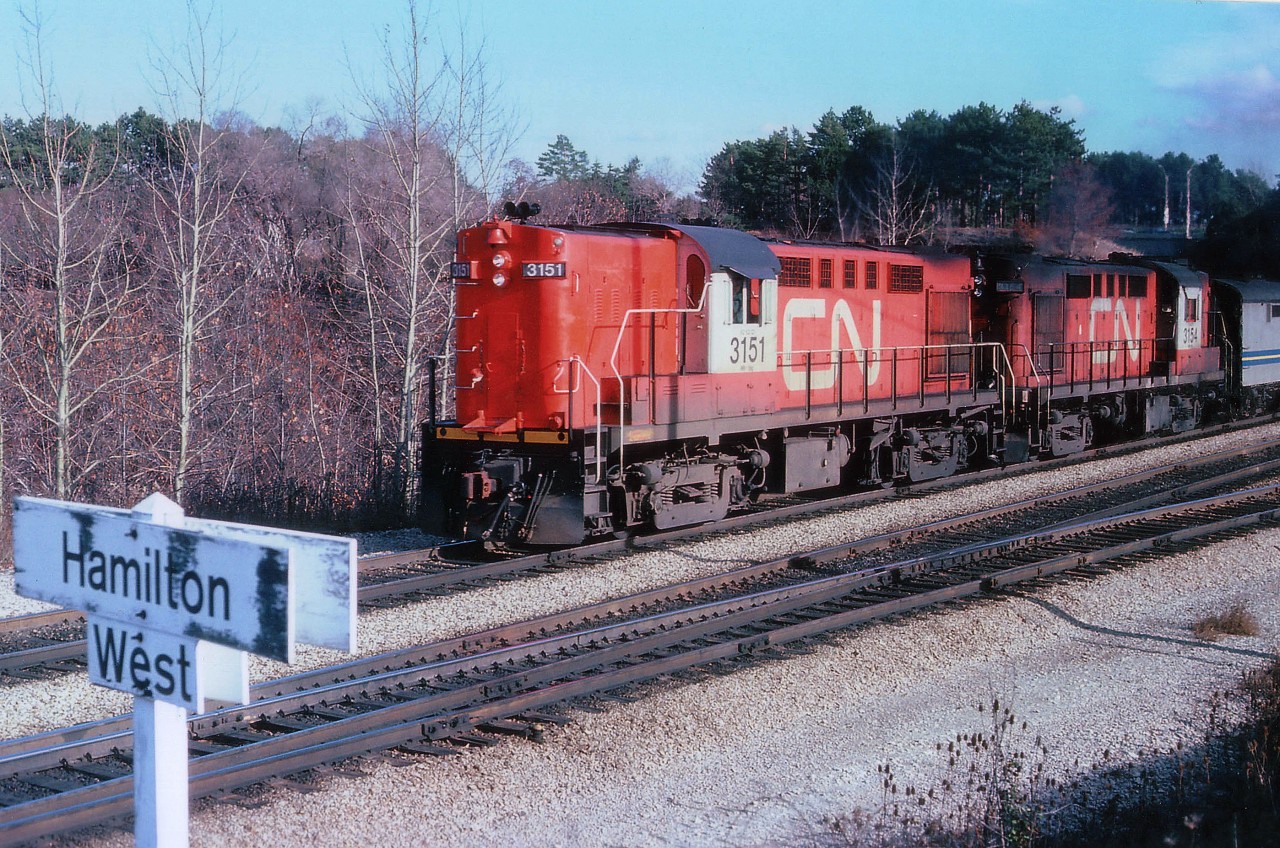I suppose if we wanted to get technical, this is actually a VIA rolling thru Hamilton; as I am unclear just where the Hammy boundary ends, and as of a few years ago there is no longer a railroad location here known as Hamilton West. VIA, in its infancy in this scene, took over all CN passenger equipment Mar 31, 1978, and CP equipment in September.  This "Tempo" train has 3151 and 3154 westbound mid-afternoon.....this run was eliminated during cutbacks some years ago.....I think it was #83.  Anyone?