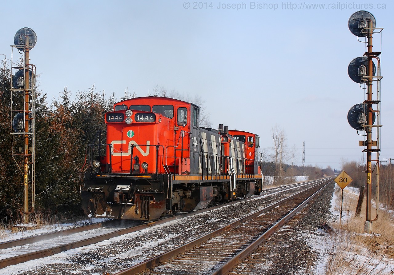 CN 1444 and CN 1437 head East as light power through Copetown West after giving CN 149 a shove up the hill.  149 stalled somewhere around Dundas and CN 550 was called out of Aldershot to assist them, getting to see two GMD1's working together!