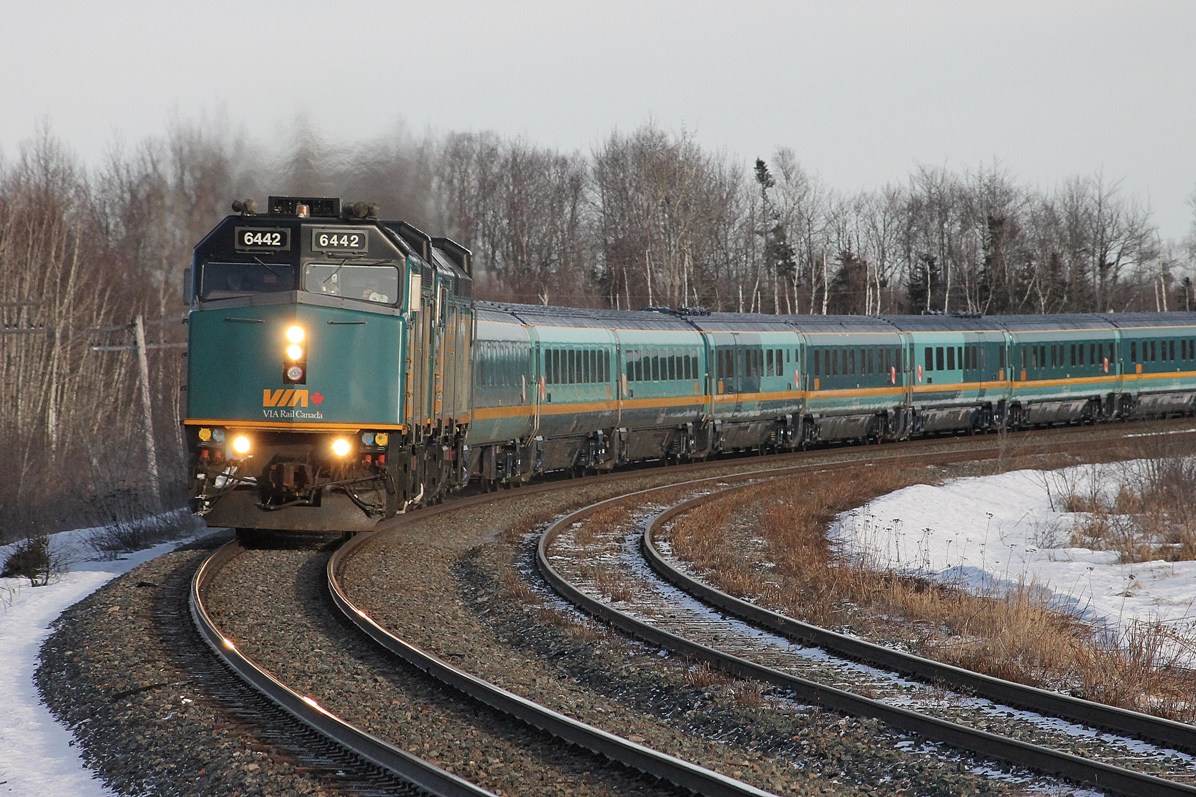 VIA 15 with 2 rebuilds on the point sails around the elevated curve at the east end of Painsec Jct
