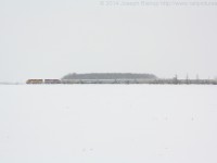 <b>Pacing a Train</b> <br>While heading back to Stratford after meeting 581 near Mitchell Ontario, Rob slowed down to allow me to grab a couple of pace shots across an open field.