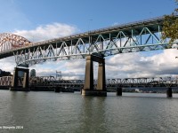 Amtrak 204, a General Electric P42DC which has been on the Amtrak Cascades for a few days, heads past the large river in New Westminster, BC with passengers bound for Portland, Oregon. 