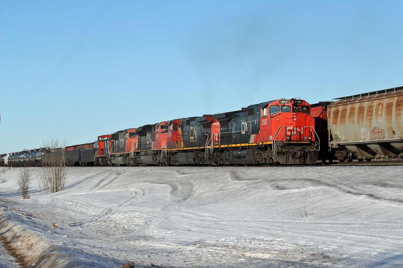 Heading east out of Edmonton meeting a westbound on the double track at Ardrossan.  Lots of power on this one. DASH 9-44CW's #2507 and 2587 followed by SD 70M-2 #8837 and SD 75I #5744 and bringing up the rear GMD1 #1440, probably on its way to Winnipeg or Toronto for disposal.