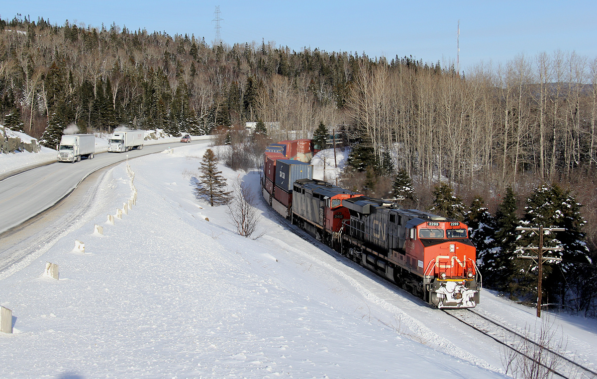 A detoured Q111 rolls through Ripple, Ontario running from Reynolds/Boyne to Thunder Bay on the CP.