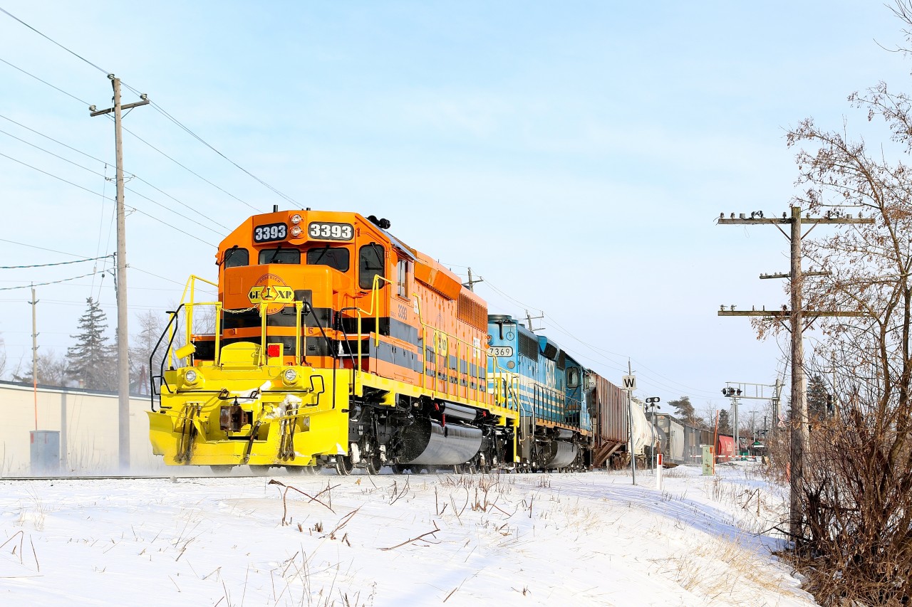 Freshly repainted and renumbered GEXR SD40-2 3393 formerly GSCX 7362 along with GSCX 7369 are getting back up to track speed after protecting the HWY #7 crossing in Acton. This is GEXR's first six axle unit repainted into G&W paint.