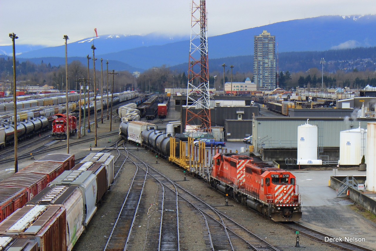 The Sumas Turn heads east out of the yard on it way to Abbotsford to interchange with SRY and BNSF along with a few skeleton cars for Kanaka creek pole co.