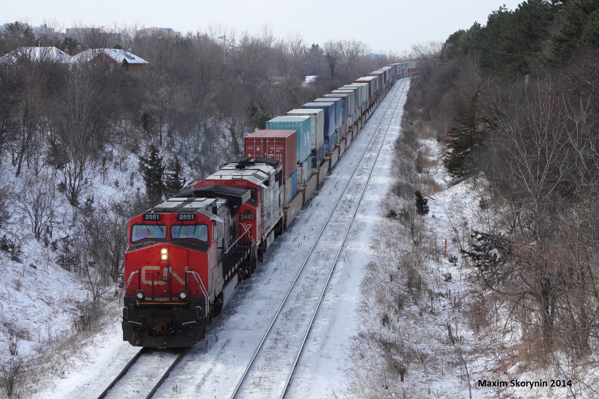 The only of the 2 eastbounds of the day pass thru Hilda bridge at mile 20 of the York subdivision with a cowl trailing.