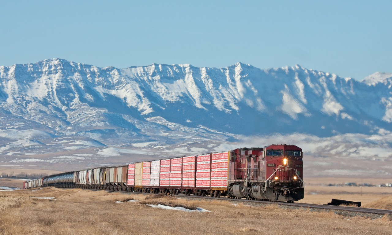 CP 9646 is climbing the grade out of Cowley Alberta towards Pincher Creek on a nice but very windy January day.