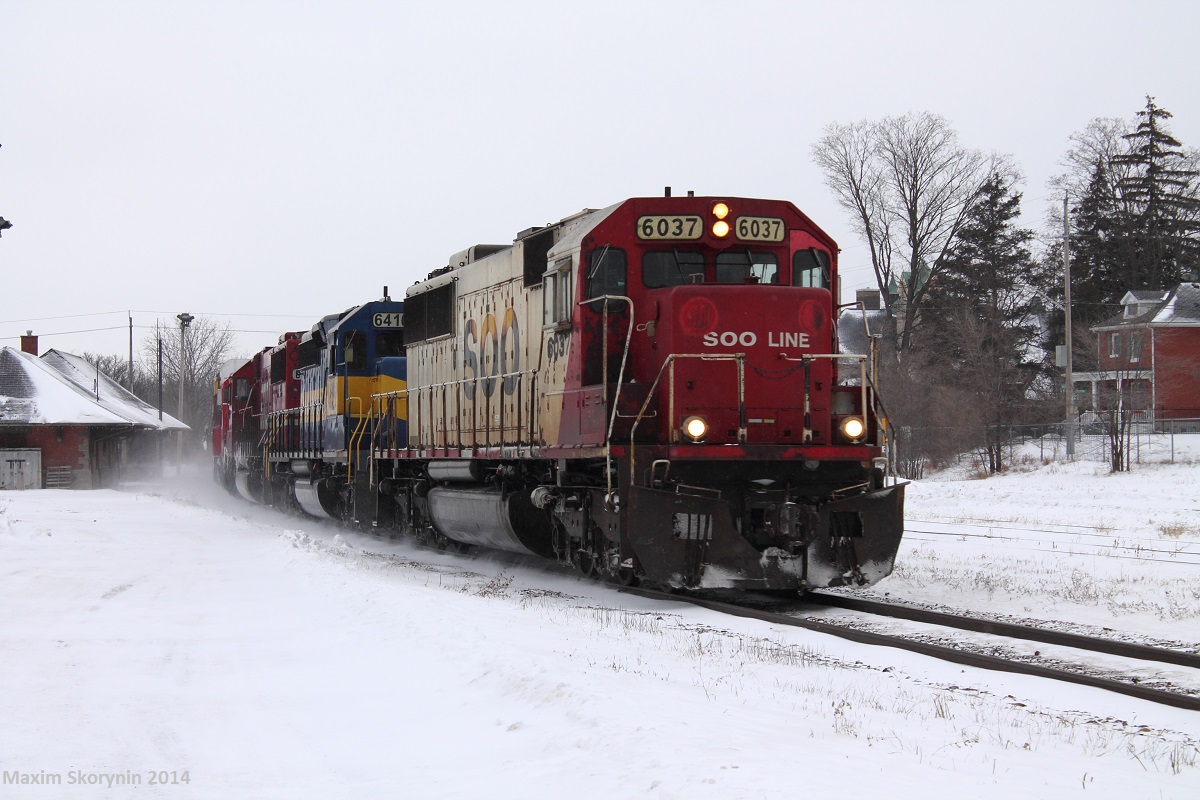 A very special surprise as Canadian Pacific train 242 rolls past Galt yard at mile 57 of the Galt subdivision just east of Orr's Lake with SOO6037-ICE6410-SOO6044-CP3062-CP3117. It was a very long 2 hour cold wait but very worth it! Im hoping to see something like This again! Also, I believe I was the first one to catch this train on the Galt sub before Railpictures.ca contributors Alex Titu and Warren Schlo got it on the new pedestrian bridge in Milton.