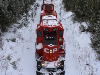 CP T08 cuts through fresh snow on its way eastward to Havelock yard 