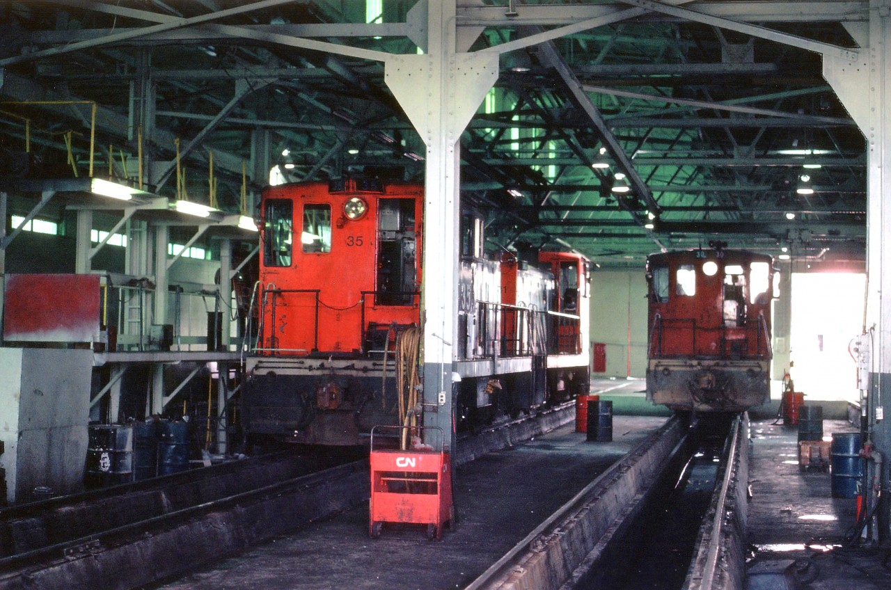 A peek in the Island diesel facility finds 3 of the 4 seventy-tonners inside on this Friday afternoon. Seen are CN 35, 41 on the left, and #30 on the right.  The other active unit, #40, was sunning itself outside. All were gone from the CN roster by 1983, the #30 went to the Delson, Quebec RR museum.