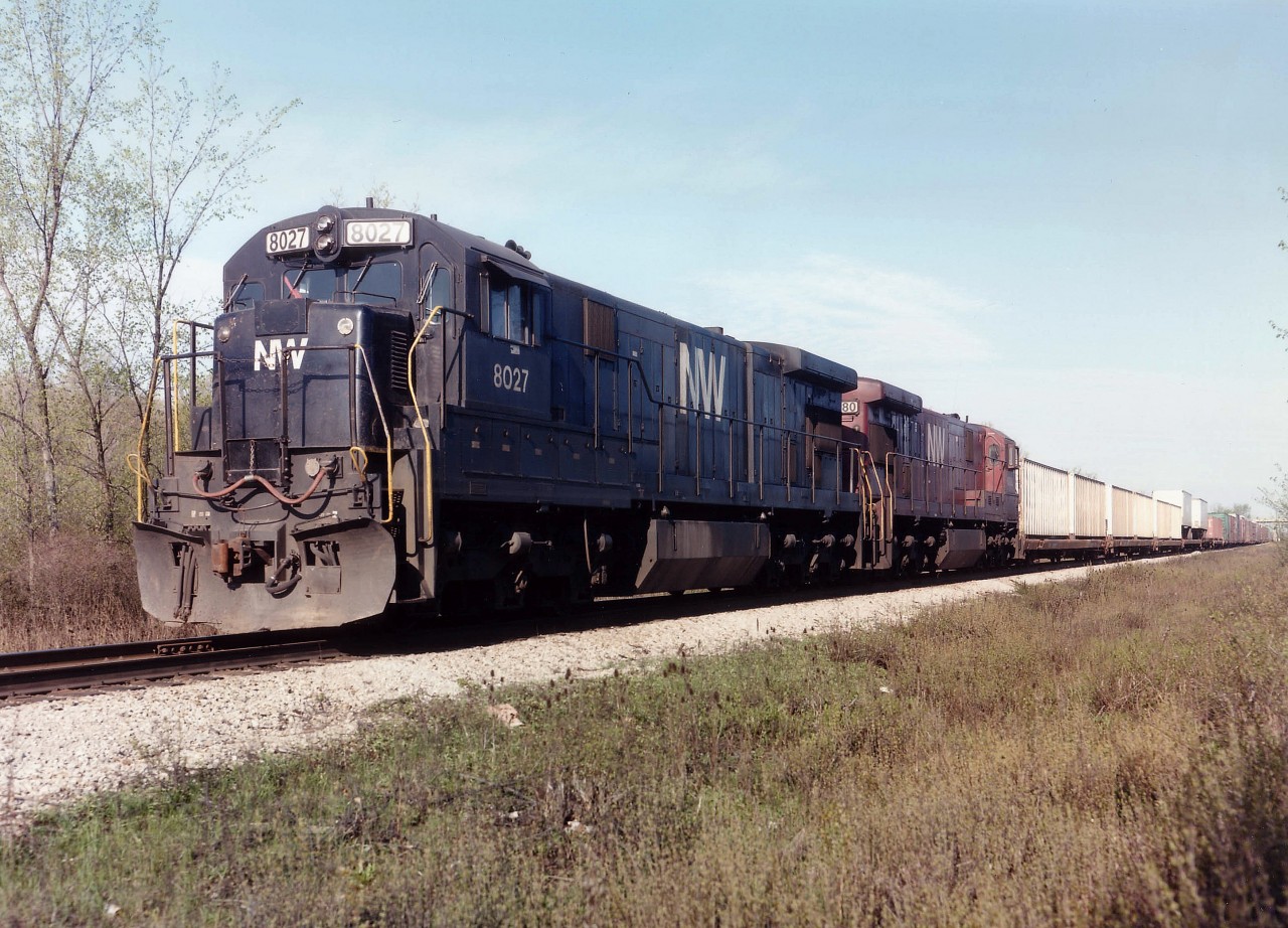 The daily N&W train from Windsor to Fort Erie this day sports a couple of C-30-7s, but the unusual feature here is the second unit, NW 8080 in maroon paint. As far as I can recall there were very few of these, perhaps only a couple, I think 8079 was the other. Anyone with information? And why this deviation from the almighty Black?? A great catch, and made this days' meandering down to Fort Erie a memorial one. One can just see the QEW overpass in the far right background.