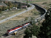 Southbound PV (Peace-Vancouver) freight navigates the loop at Pavilion as it descends toward the bottom of the Fraser Canyon at Lillooet. Note the track speeder in the clear