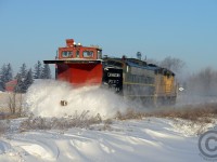 The flanger blades of 107 (!) year old CP 401005 (Built 1907, rebuilt 1927) do not quit on the approach to Mount Elgin on the Port Burwell sub. After a few days of extreme cold, wind and snowstorms a considerable amount of precipitation had built up on the right of way. The day prior a train ran to Tillsonburg and pushed much of the snow aside. However, warm weather is forecast to arrive on Saturday, and a deep freeze on Sunday - the need to clear the right of way and flangeways of snow before it all turned to solid ice necessitated this plow run.<br><br>After following OSR for a while I decided to head home via Stratford after hearing GEXR ran a plow the night before to Goderich. I expected to get a shot of the train parked at the station for the day, but upon arriving I was treated to a plow extra arriving engines first from Goderich, and immediately turning west, for a second plow train on the same day. An experience never to be forgotten and one can only hope but duplicate again in the 21st century. Second photo: <a href=http://www.railpictures.ca/?attachment_id=12924>http://www.railpictures.ca/?attachment_id=12924</a>