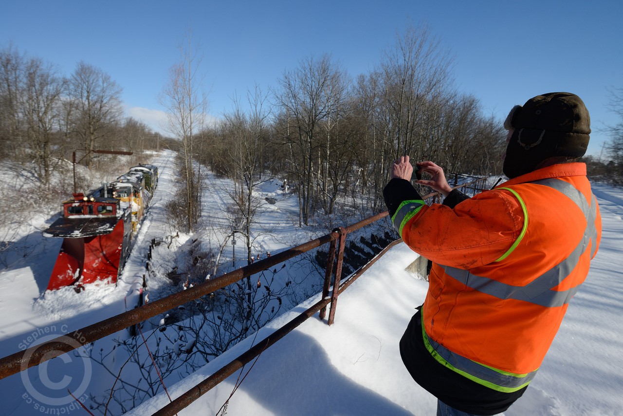 Brad Jolliffe - Ontario Southland Railway General Manager and one of two men in the Plow has posed his train under the telltale for a photo.