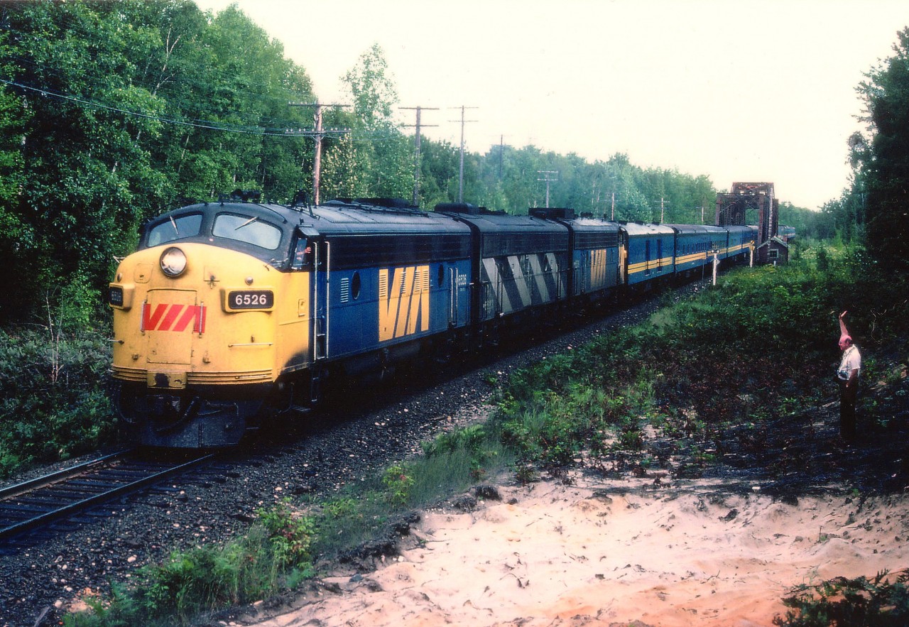 The "Super C", northbound with VIA 6526,6627 and 6539 has just crossed the Severn River north of Washago in this early fall image. The venerable railbuff Wm D. (Bill) McArthur gives the crew a wave.