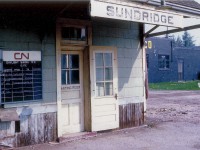 Strictly an image for nostalgia buffs, this old view at Sundridge, about 50 miles south of North Bay, represents a glimpse of an era long gone. Note the sorry condition of a structure and a way of travel that has for all intents and purposes, vanished. The old schedule board was a fixture at all stations; maybe not as nice as this one, but....... Storm windows clipped on the outer door, to be removed and replaced with screen once the weather improves...heck, it is only March. Old Sunoco garage out back. Yeah. This is a classy way to travel. No wonder there is no passenger service thru this community of barely 1,000 souls anymore. I don't recall when this building was demolished, but I suspect at least 30 years ago.