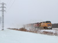 UP 5510 with CP 8642 are in charge of train 608 at mile 99 on the CP's Windsor Sub on a blustery winter day.