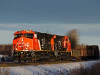 CN ES44ACs 2836 and 2848 hustle Prince George bound M347 west on CN's Edson Sub. They departed the west switch at Wildwood just seconds ago.