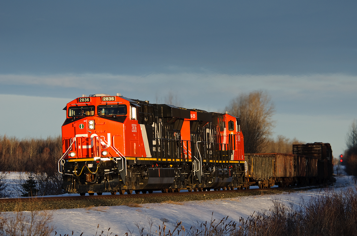 CN ES44ACs 2836 and 2848 hustle Prince George bound M347 west on CN's Edson Sub. They departed the west switch at Wildwood just seconds ago.