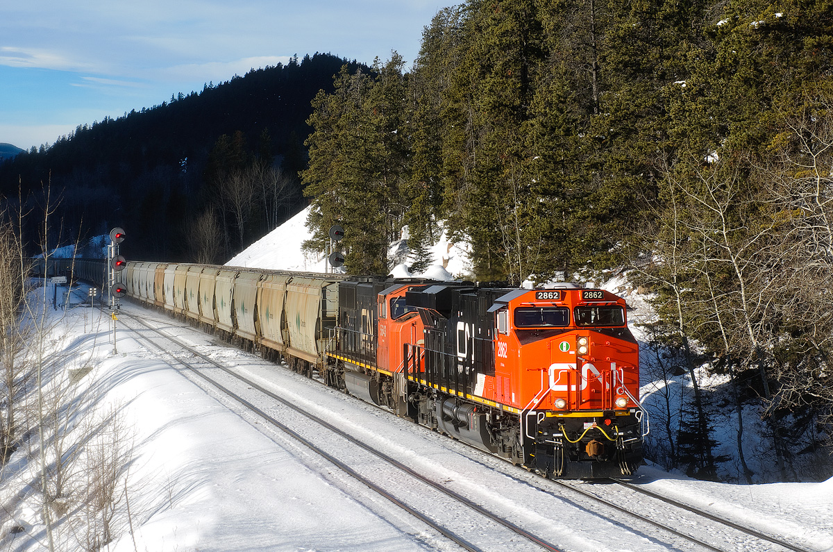 North Vancouver, BC - Allan Mines, SK potash empties (Train B75851 17) depart the north track at Wynd behind a new CN ES44AC.
