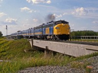 Years before the second track was added between Ardrossan and Uncas Via's eastbound Supercontinental headed by FP9A #6306 crosses the baseline road bridge at Ardrossan.