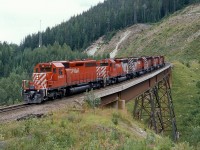 Now this you are not likely to ever see again.  Before CP's second main line was built through Rogers pass extra power was needed to get heavy westbound trains up the grade.  Here a 6 loco helper set is seen on Mountain Creek Bridge running light down hill to wait at the bottom for it's next assignment.  All SD40-2's #5632 is in the lead, followed by 5775 and 5647 in "Expo '86" livery, then 6044, 5692 and 5957.