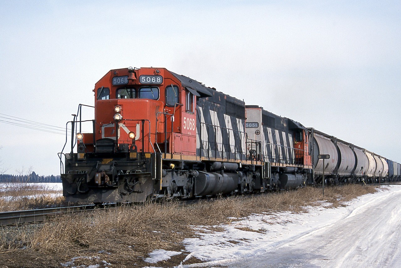 The last of CN's SD40s lived out their last days based out of Edmonton, Alberta. Tired looking CN 5068 and 5051 are seen leading train 512 approaching St. Paul Junction on the north side of Edmonton.