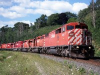 CP 9017 leads a southbound through the sweeping curve beside Kay Drage Park. Action red at its finest (aside from MLW's).