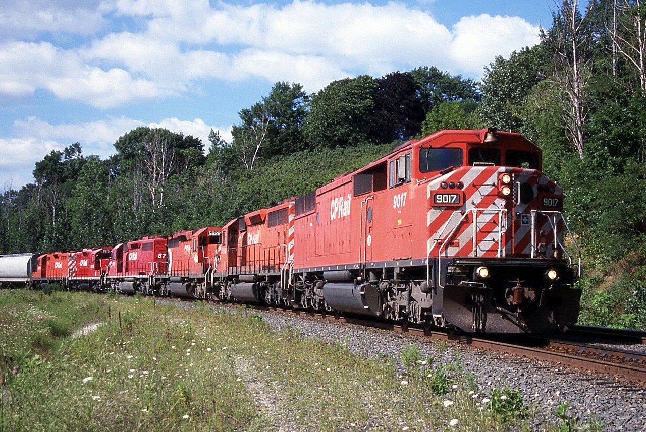 CP 9017 leads a southbound through the sweeping curve beside Kay Drage Park. Action red at its finest (aside from MLW's).