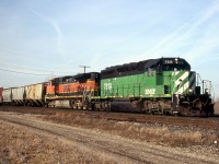 Back in 2006 foreign power was plentiful, and 394 often ranked BNSF power. Ex. BN SD40-2 7819 leads BNSF 984 through Paris on a snowless January day. 