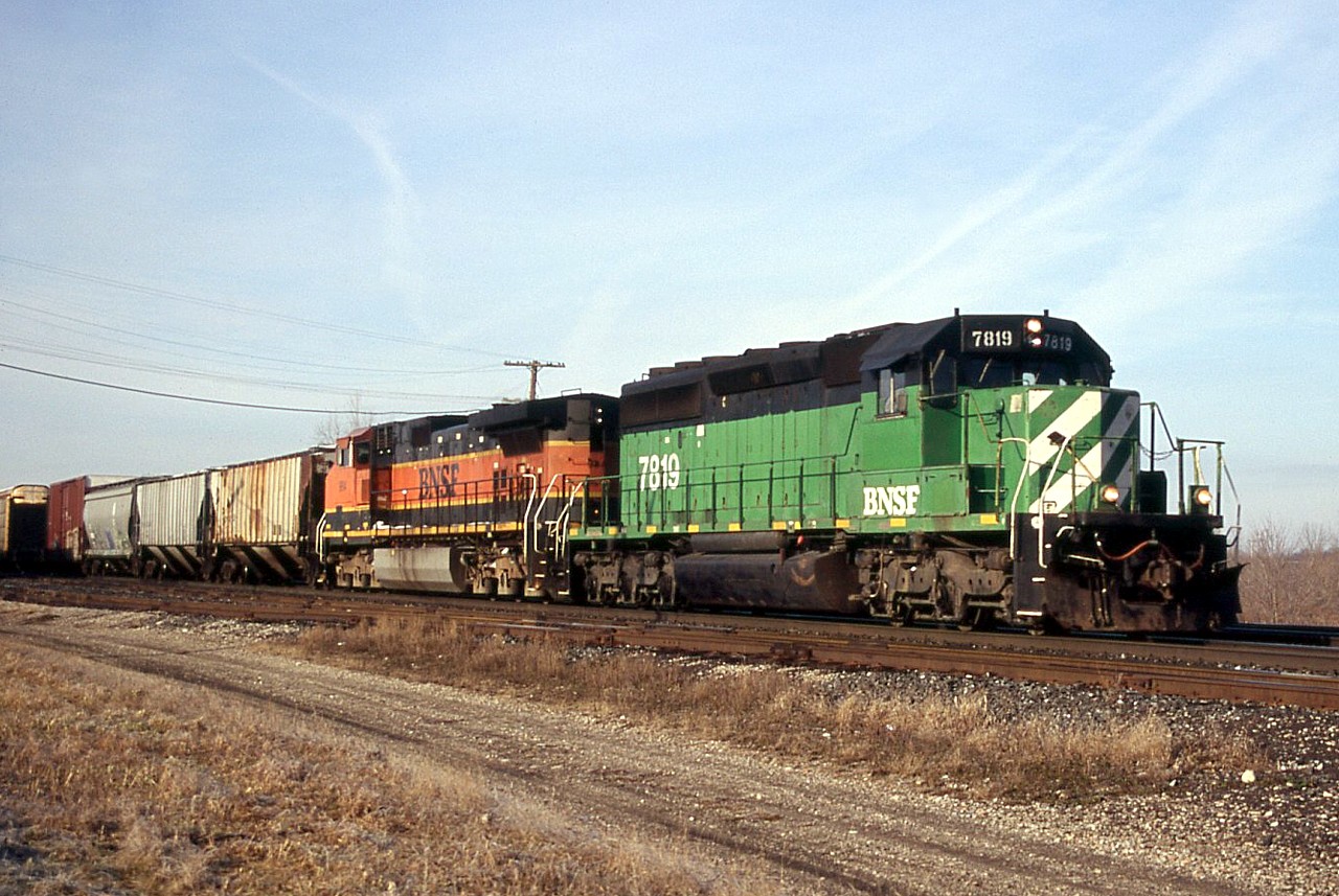 Back in 2006 foreign power was plentiful, and 394 often ranked BNSF power. Ex. BN SD40-2 7819 leads BNSF 984 through Paris on a snowless January day.