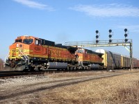 CN 393 with BNSF 4394 and 4542 pass under the signal bridge at Paris Junction.