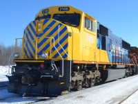 She's back! SD75I #2105 rolls past the camera trailing 5th out on the 214 lash up as the crew backs up the power to hook up to the tonnage.  2105 returned 2 weeks ago after being side lined for 12 months after a run in with a log truck December 2012.