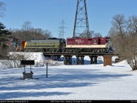 What must be a record year for Plow Trains the OSR Plow Extra crosses the Wooden Bridge By the Snow Covered Tamarack Ridge Golf Course