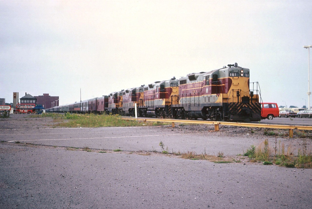 I suppose, if you are familiar with the AC Tour Train, after viewing this photo, you might ask yourself "What went wrong"?? In this modern age of travel, why has ridership fallen off so dramatically on the Tour Train? Is it the fare? Or perhaps the cost of travel in this province? Competition from so many American tourist lines? Whatever the reason, there aren't many passenger trains of this length any more. My notes state 27 cars behind AC 161, 172, 156 and 164 on this rather humdrum fall day. The depot is on the left, w-a-y back there.