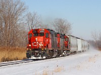 A fine winter day sees CN 4707 and 4130 in charge of Windsor bound train 439 on the curve at Lighthouse Cove, mile 77.3 on the VIA's Chatham Sub.