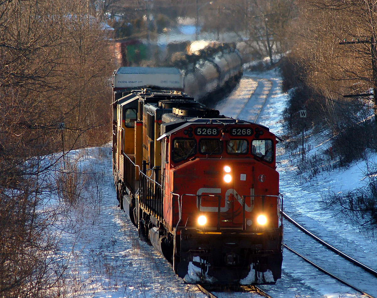 CN 382 leaning through the "S" curve at John Ave with CN 5268, UP 3778 and UP 7342 leading 146 cars