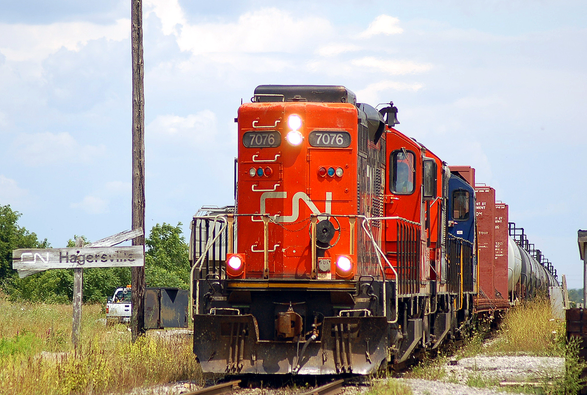 An SOR Extra from Brantford consisting of CN 7076, CN 7068 and RLK 1755 passing through Hagersville with 46 cars