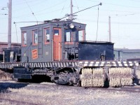 Canadian National electric sweeper car 22, assigned the Oshawa Railway, rests at OR's shops off Hillcroft Street. This car was originally built for the Niagara, St. Catharines & Toronto Railway, another one of Canadian National Electric Railway's lines (CNER), and reassigned to the Oshawa Railway when the NStC&T ended electric operations. Note the chain-driven sweeper, powered by an electric motor mounted just above behind the black housing.