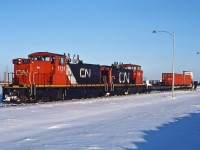 CN 1121 and CN 1116 switch at Winnipeg Intermodal Terminal on a frigid December afternoon.