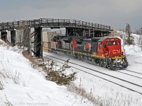With 150 OOCL cans (as well as other carriers) behind them, CN 2124 and 8019 lead 149's train out from under the Lakeshore Road bridge at Lovekin. No, I never tire of shooting here. 1431hrs.