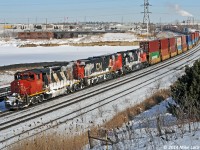 I'm sure there's a story behind the coating of ice and snow on the power, but is doesn't seem to include 121's train as it is conspicuously snow-free. Regardless, and interesting sight as they lead a very late 121 through Whitby. 1258hrs.