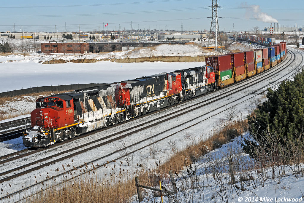 I'm sure there's a story behind the coating of ice and snow on the power, but is doesn't seem to include 121's train as it is conspicuously snow-free. Regardless, and interesting sight as they lead a very late 121 through Whitby. 1258hrs.