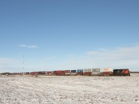 With a single unit up from and a mid train dpu this NS style SD70M-2 on point leads this 100 series priority stack east across the flat lands of the prairies.