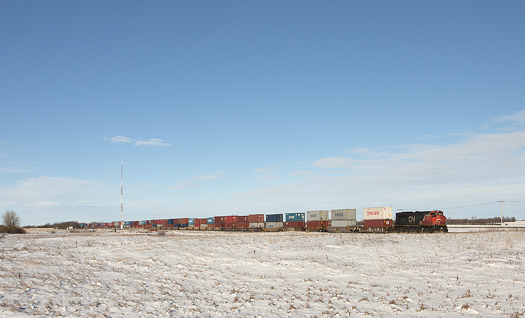 With a single unit up from and a mid train dpu this NS style SD70M-2 on point leads this 100 series priority stack east across the flat lands of the prairies.