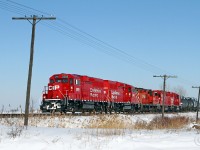 Returning to Windsor, T29's regular power CP 2259 and 2263, with CP 8249, 3007 and 2228 in tow, are westbound on the curve at Tilbury, mile 79.13 on the CP's Windsor Sub.